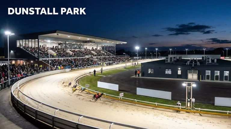 Dunstall Park greyhound stadium in Wolverhampton under floodlights on race night