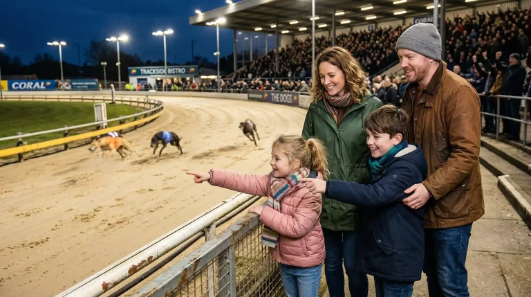 Family with children watching greyhounds race from the trackside stands